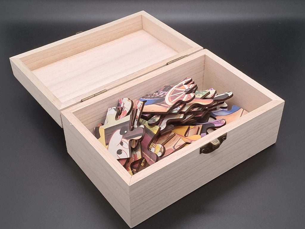 Kinderpuzzel Cadeaukistje met kleurrijke houten puzzelstukjes in een open kist